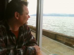Clark ponders the river, and speaks of the sturgeon he once caught.